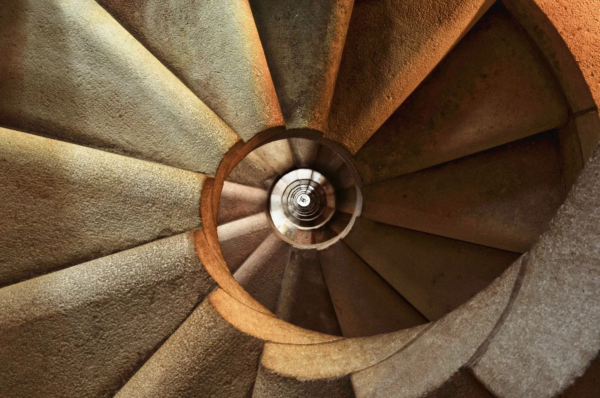 A spiral staircase seen from above, the illusion of endless progress