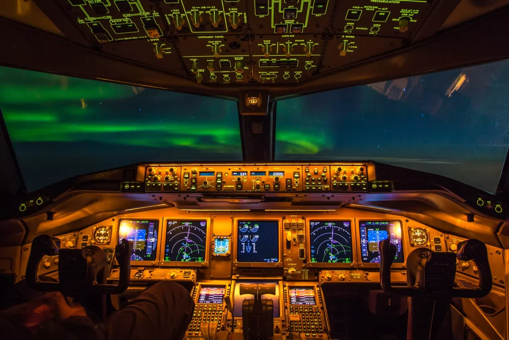 Northern Lights above the instrument panel of the flight deck