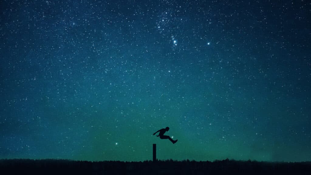 Shadow figure jumping over a pole