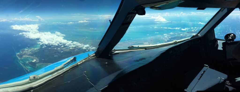 Blue oceans and islands seen through the flight deck window