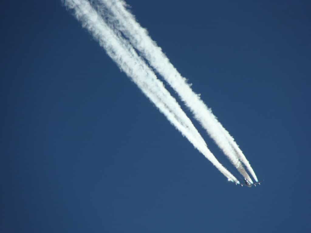 Contrails against a blue sky
