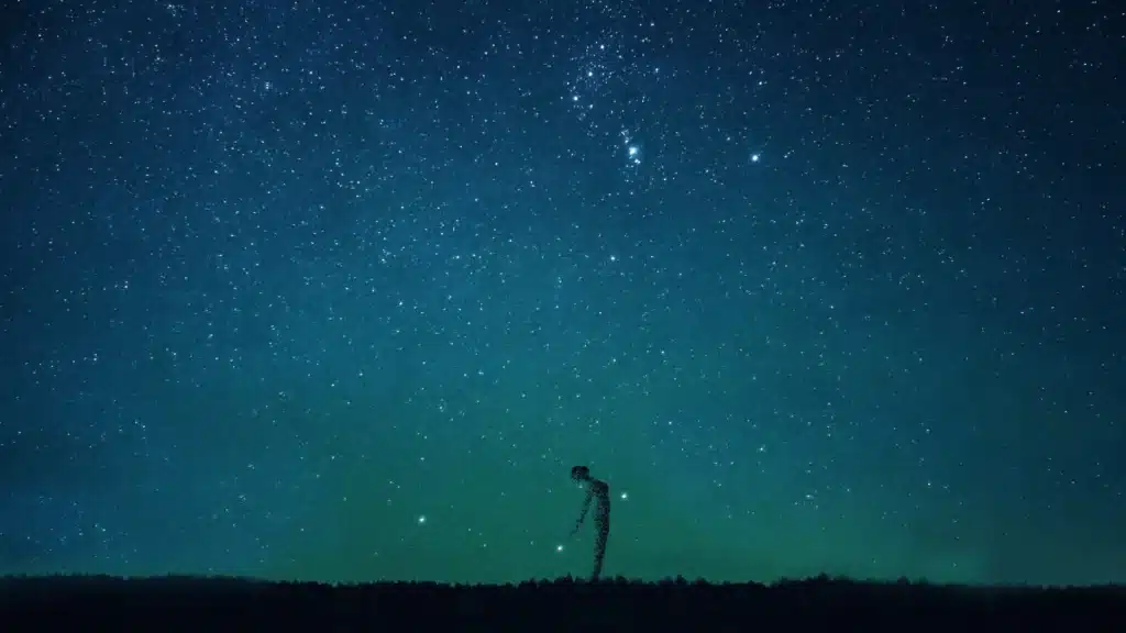 Fragmented silhouette under a starry sky